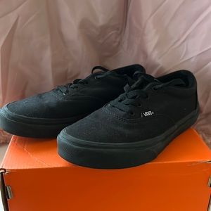 Used Black Vans size 4Y.